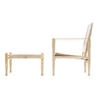 Natural wood chair and ottoman set with a light beige cushion, featuring a minimalist design and smooth, clean lines.