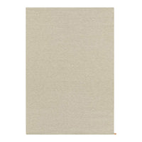 Beige textured rug with a subtle woven pattern, perfect for adding warmth to any space.