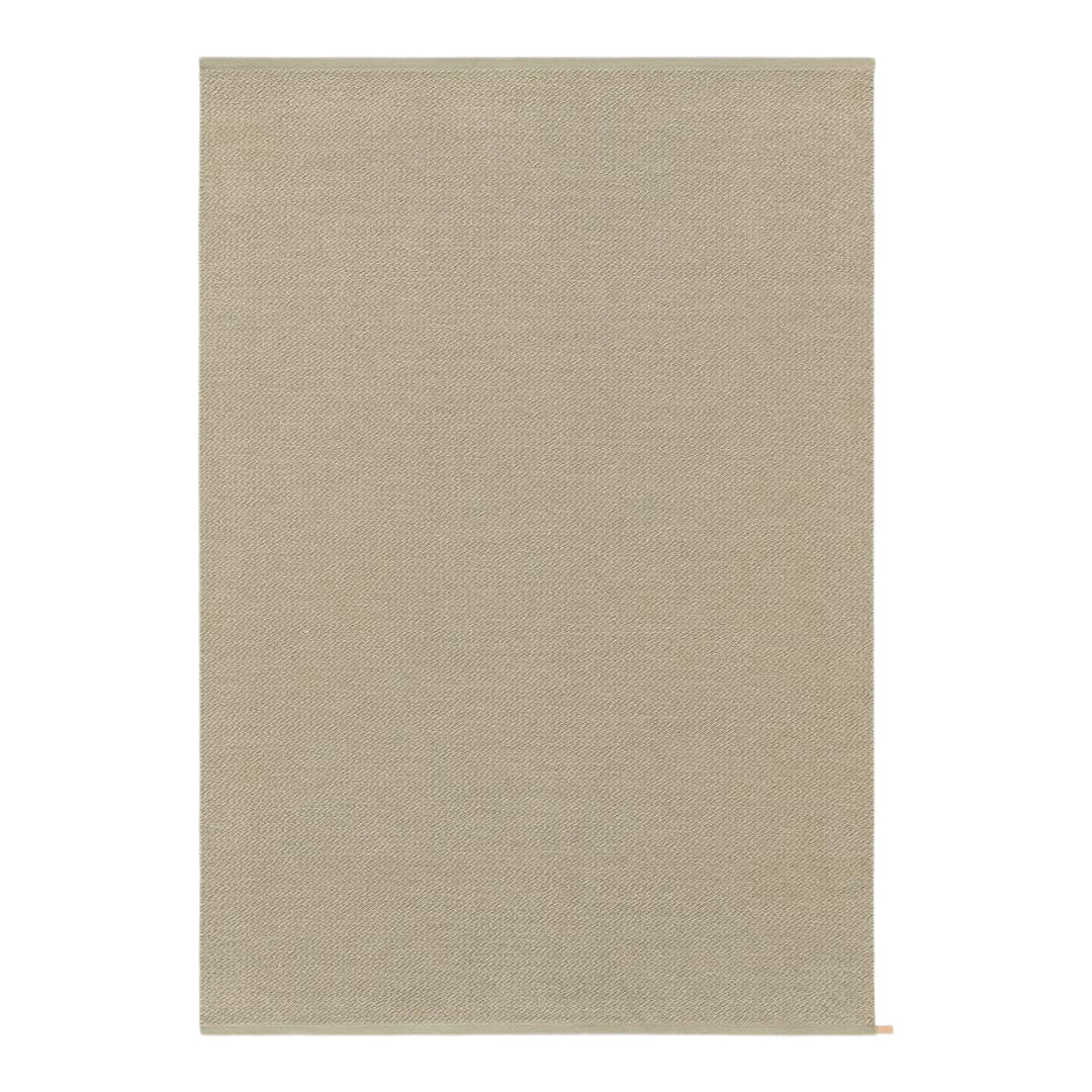 Beige area rug with a subtle, textured pattern, perfect for adding warmth to any room. Ideal for modern decor.