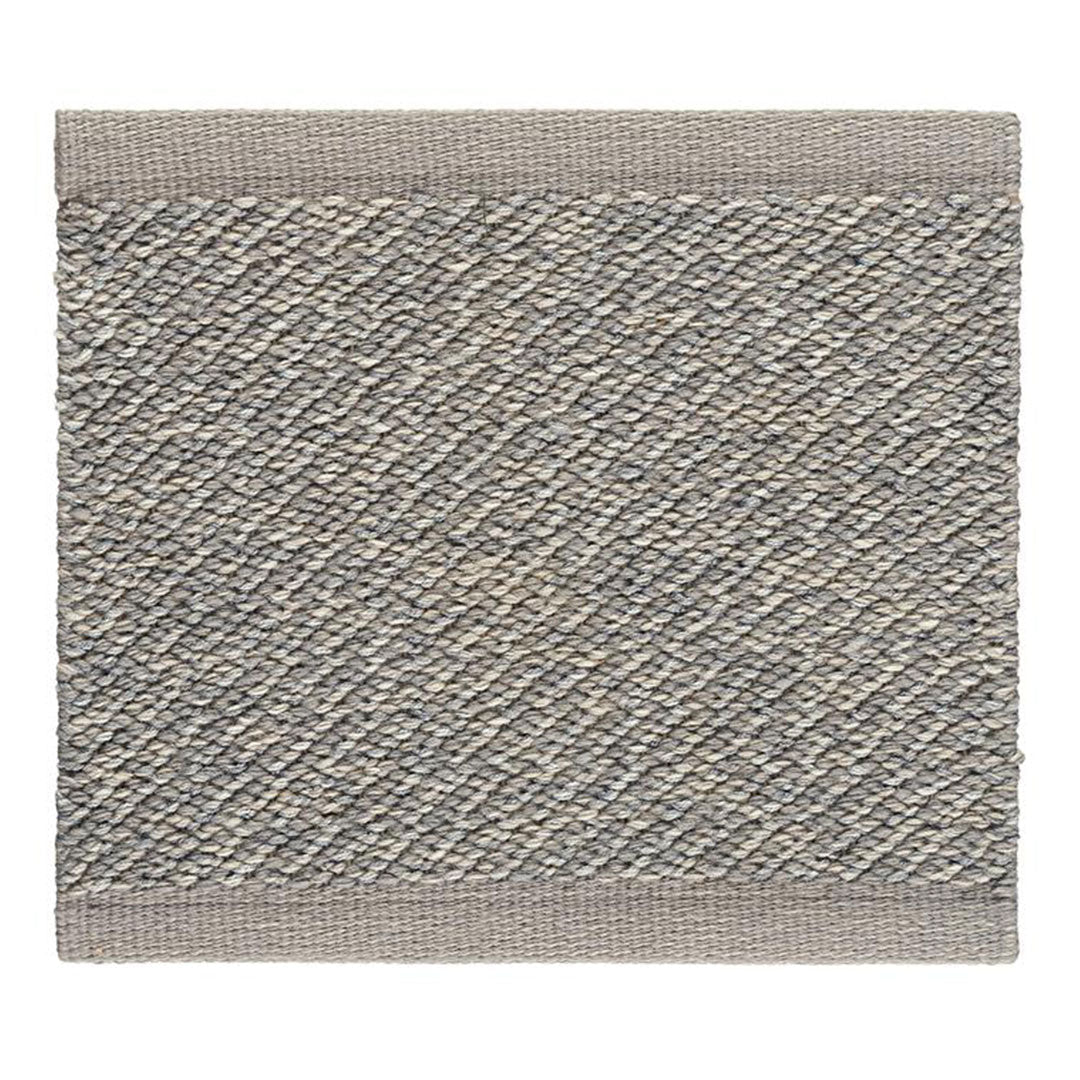 Textured gray rug with a subtle diagonal pattern and a contrasting light gray border. Perfect for modern decor.