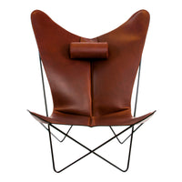 Brown leather butterfly chair with sleek black metal frame and minimalist design. Features a unique, modern silhouette.
