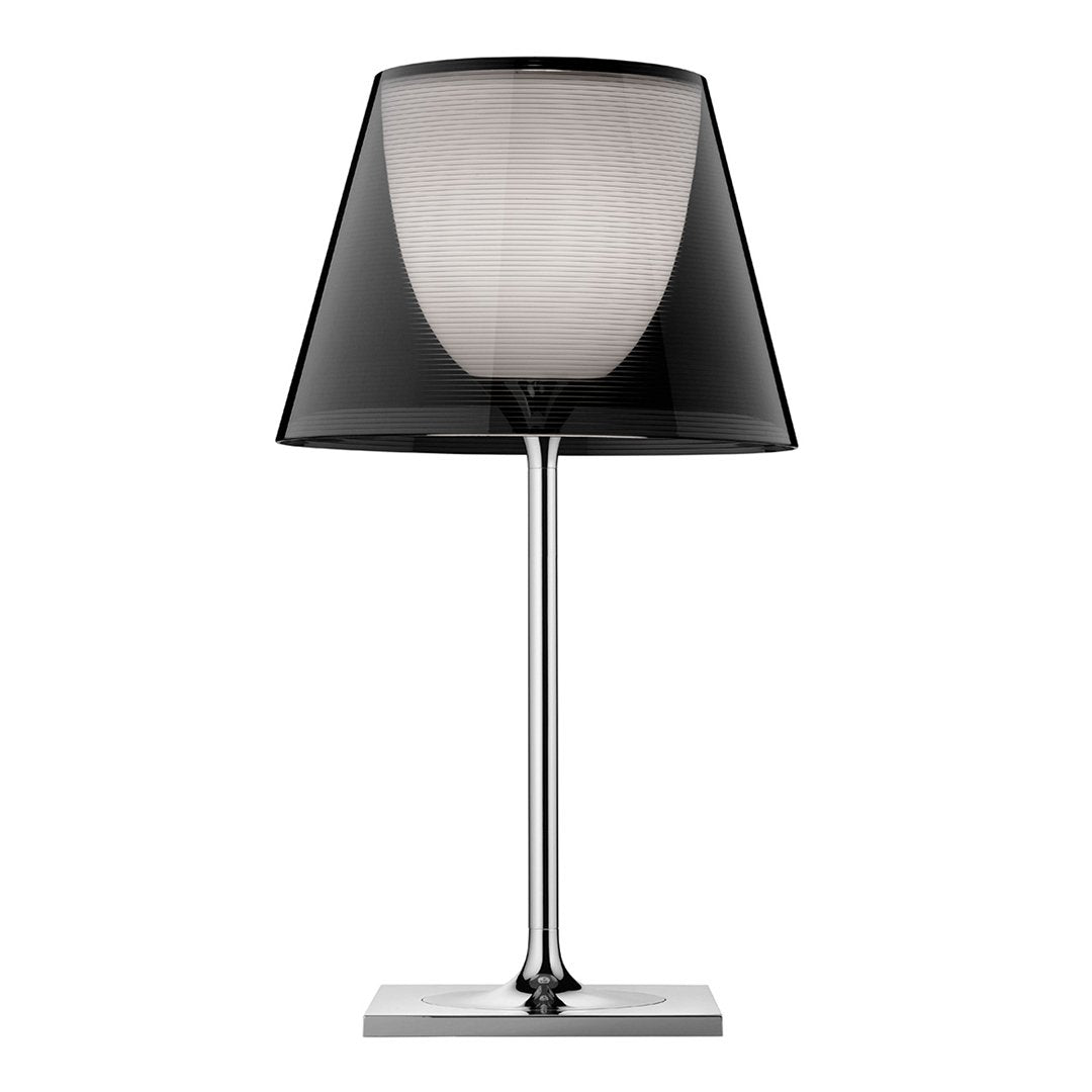 Stylish black and white lamp with a sleek chrome base and patterned shade, perfect for modern decor.