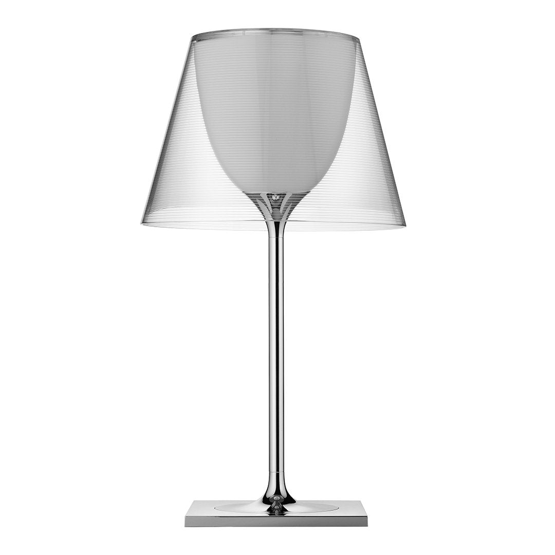 Modern clear glass lamp with a sleek chrome base and minimalist design, perfect for any contemporary decor.