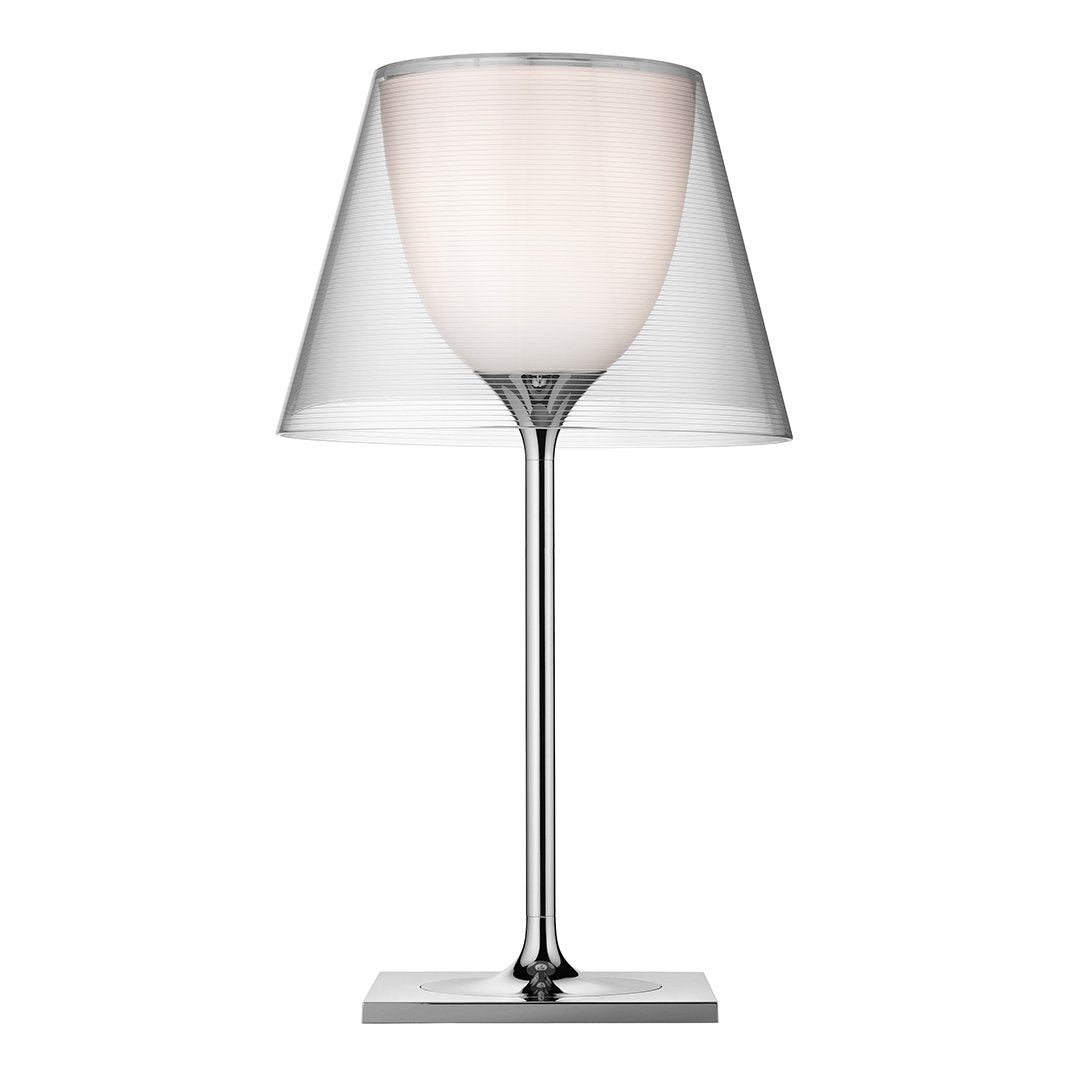 Modern lamp featuring a clear glass shade and a sleek silver base, creating a minimalist and elegant design.