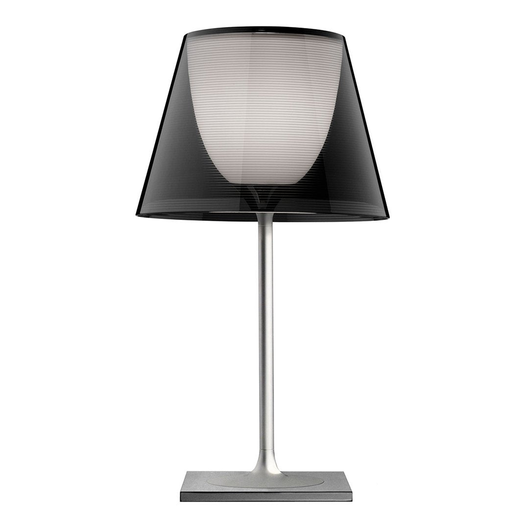 Stylish black and white table lamp with a sleek metal base and elegant shade design. Perfect for modern decor.