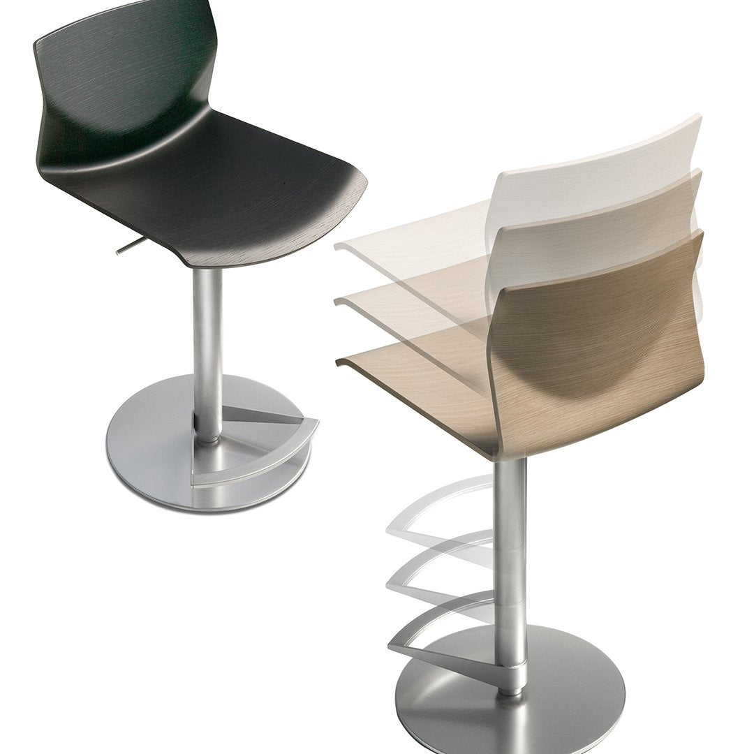 Bar stools featuring sleek black, white, and beige seats with a metallic base, showcasing modern design and versatility.