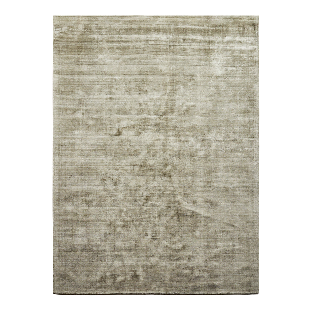 Soft, muted grey area rug with subtle texture and a minimalist design, perfect for modern decor.