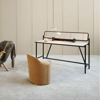 "Minimalist black and beige desk with a sleek design, complemented by a soft textured chair in warm tan hues."