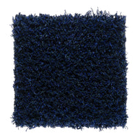 Soft navy shag rug with textured, fluffy fibers in deep blue hues. Ideal for adding warmth to any space.