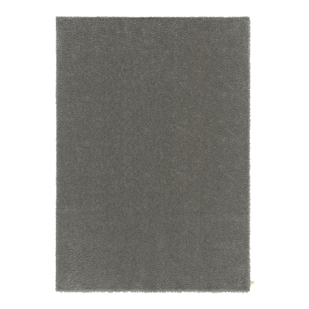 Gray textured rug with a soft, plush finish, perfect for adding modern elegance to any space.