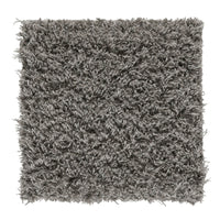 Soft shaggy rug in a textured gray color, adding warmth and depth to any room design.