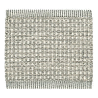 Textured woven rug in neutral tones of gray and cream, featuring subtle striped edges for added detail.