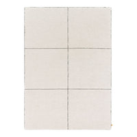 Light beige area rug with subtle gray grid pattern, ideal for modern decor.