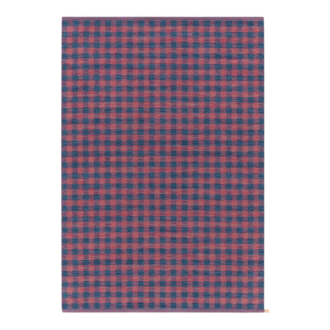 Red and navy blue checkered pattern on a textured fabric background. Ideal for stylish home decor.