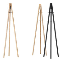 Natural wood and sleek black tripod stands in a modern design, featuring clean lines and minimalistic patterns.