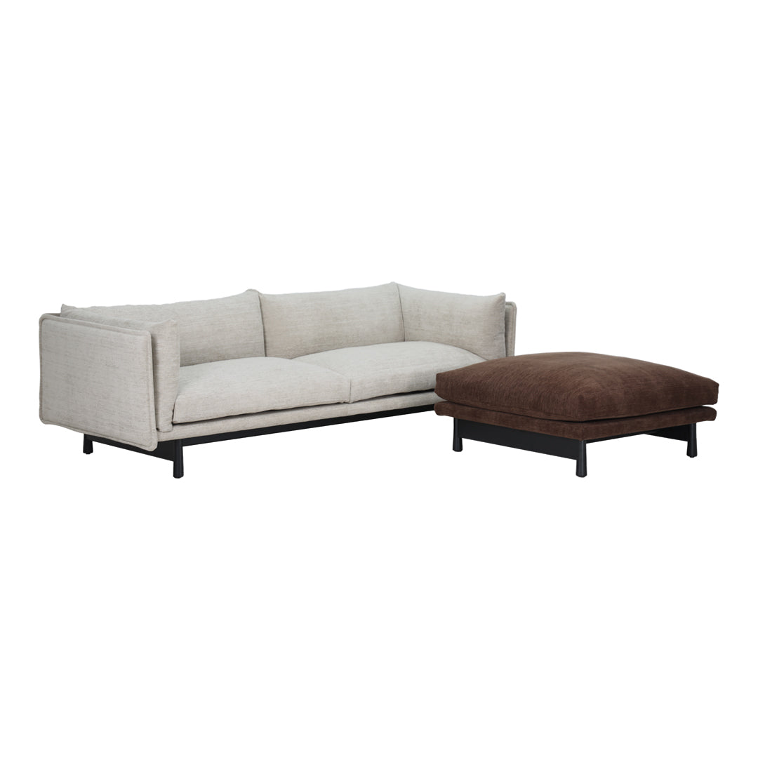 Modern light gray sofa with clean lines and a dark brown ottoman, perfect for contemporary living spaces.