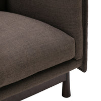 Brown textured fabric with a subtle pattern, featuring a sleek design and sturdy legs. Perfect for modern decor.