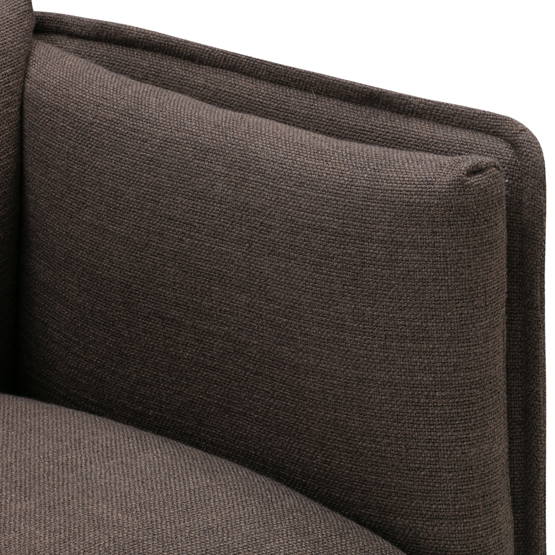 Brown textured upholstery with a subtle, woven pattern for a modern couch design. Soft and stylish accent piece.