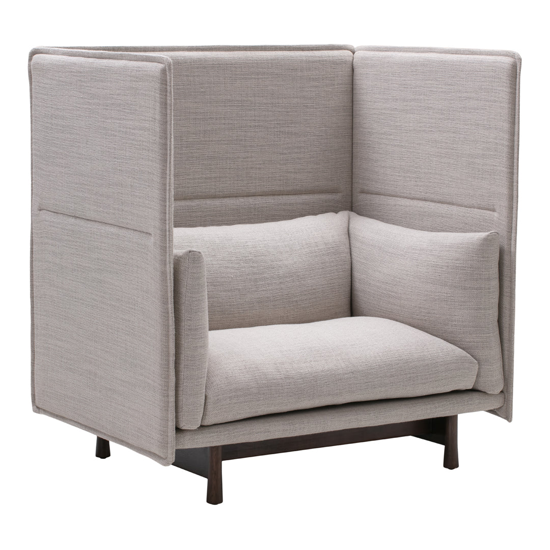 Light beige upholstered chair with a minimalist design and subtle textured pattern, featuring a supportive backrest and armrests.