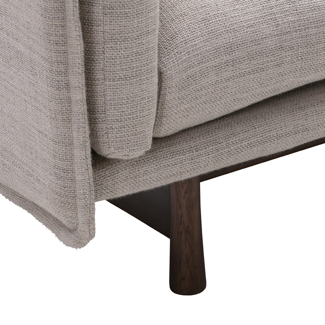 Light gray textured fabric sofa with smooth wooden legs, featuring a clean and modern design.
