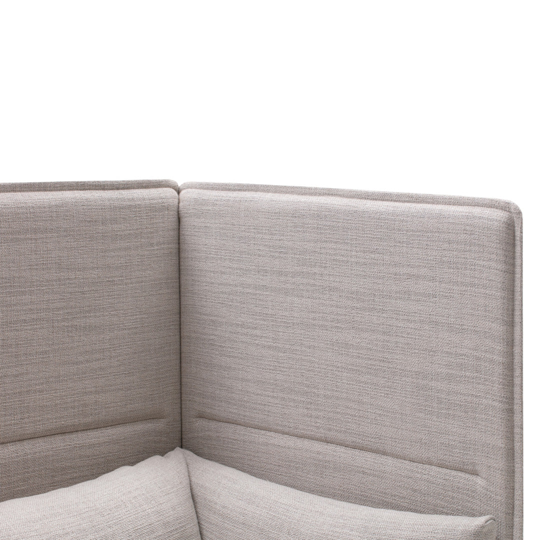 Light gray upholstered corner couch with a textured fabric pattern and clean lines.