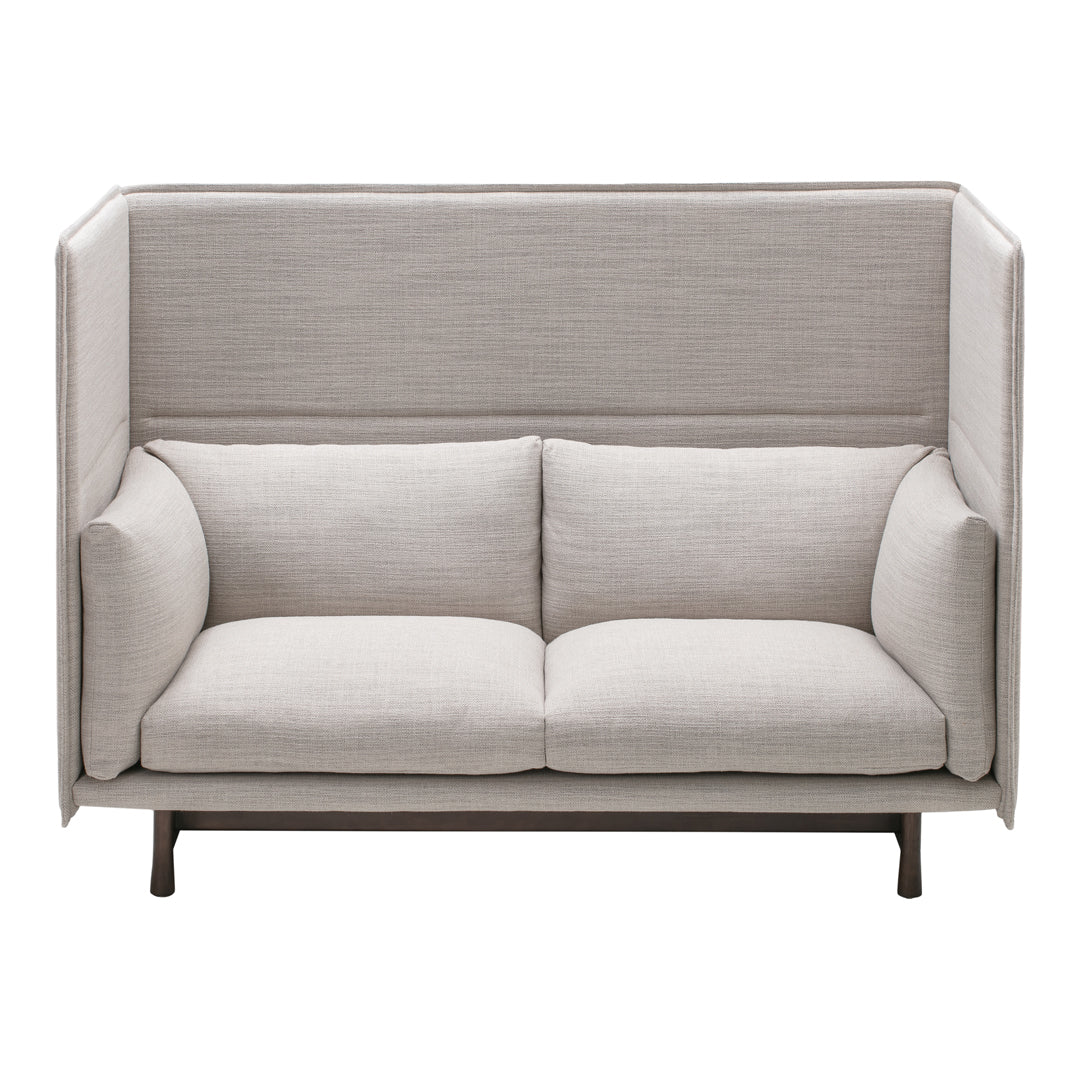Light gray upholstered sofa with a minimalist design and smooth texture, featuring a solid black base.