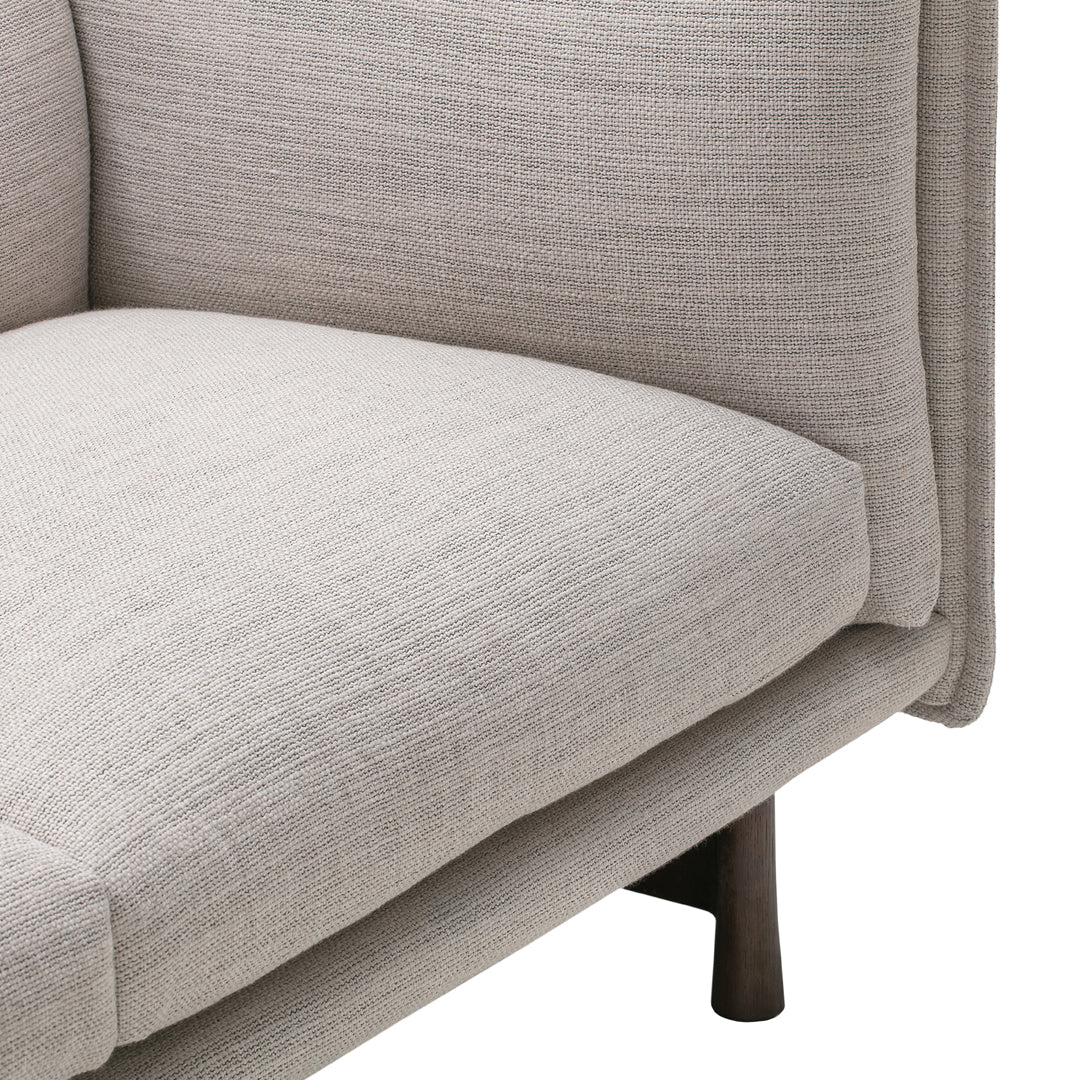 Light beige upholstery with subtle texture; modern design with clean lines and natural wood accents.