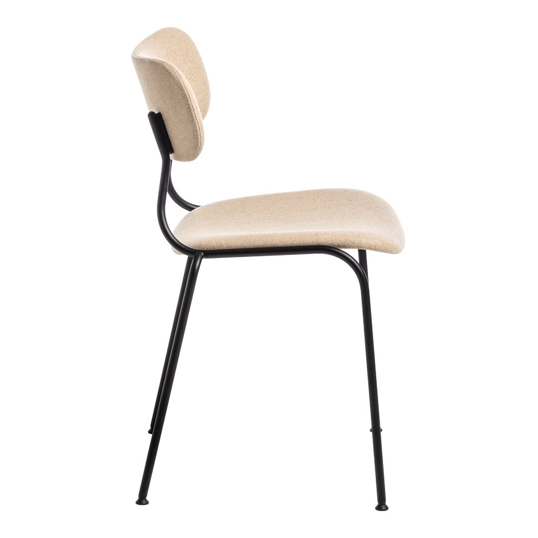Beige upholstered chair with a smooth texture and black metal legs, featuring a simple, modern design.