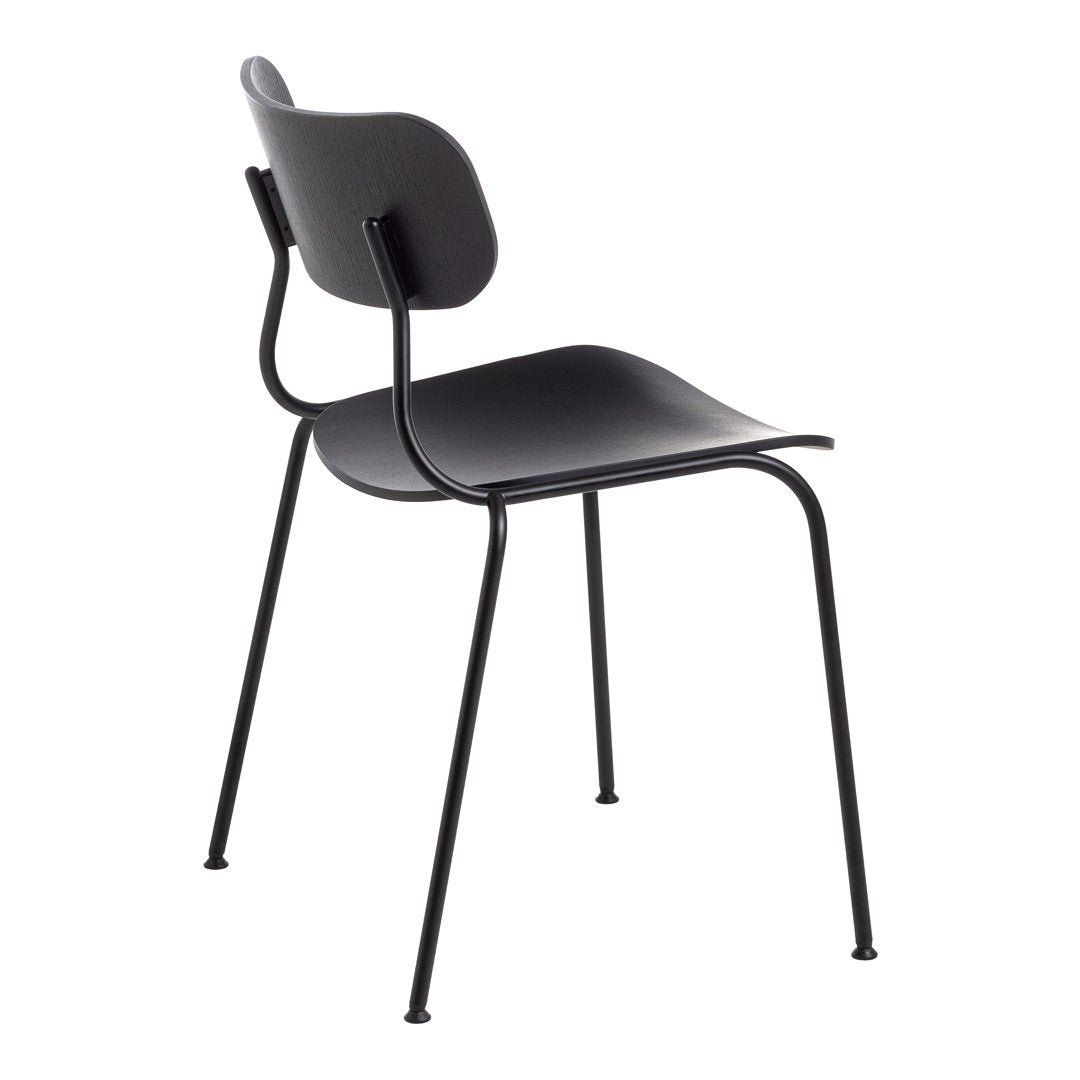 Minimalist black chair with smooth curves and sleek metal legs, perfect for modern decor.