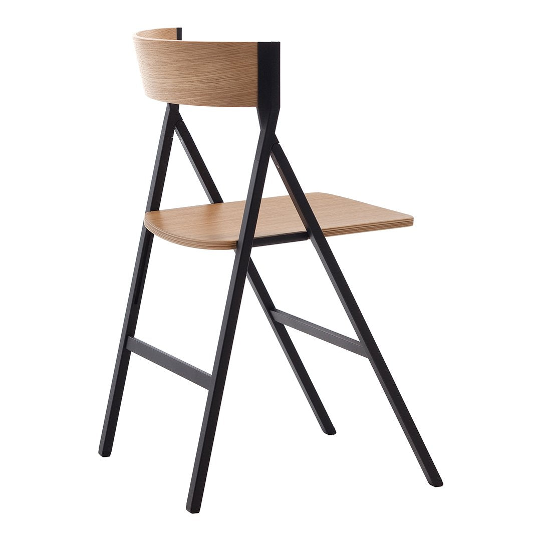 Modern chair with a light wood seat and backrest, complemented by a sleek black metal frame.