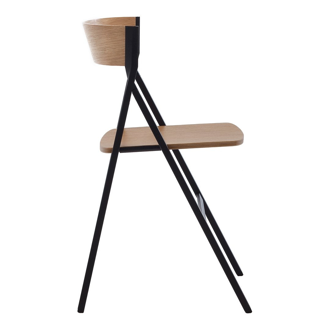 Modern black and light wood chair featuring sleek lines and minimalistic design. Perfect for contemporary decor.