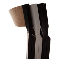 Three stacked lamps in black, grey, and natural wood, showcasing sleek modern lines and a minimalist design.