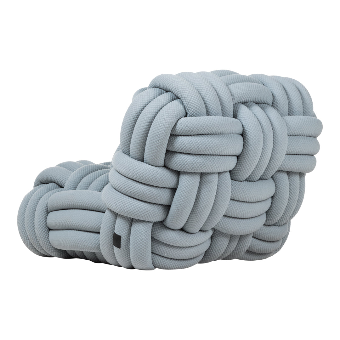 Soft light grey knotted seating with textured pattern, ideal for modern decor. Perfect for adding a stylish touch.