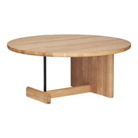 Round wooden coffee table with a natural finish and minimalist design, featuring a smooth surface and subtle grain patterns.