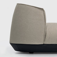 Textured grey fabric chair with a matte black base for a modern, stylish accent in any space.