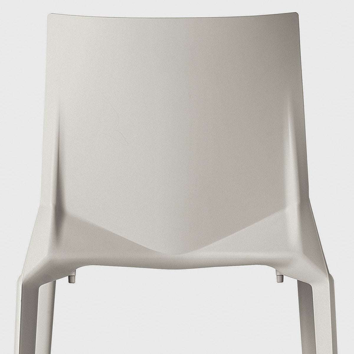 Light gray minimalist chair with a smooth, matte finish and contemporary design. Perfect for modern interiors.