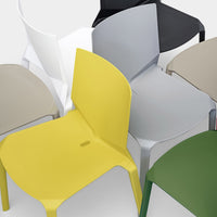 Colorful chairs in yellow, gray, white, green, tan, and black with sleek, modern designs and smooth finishes.