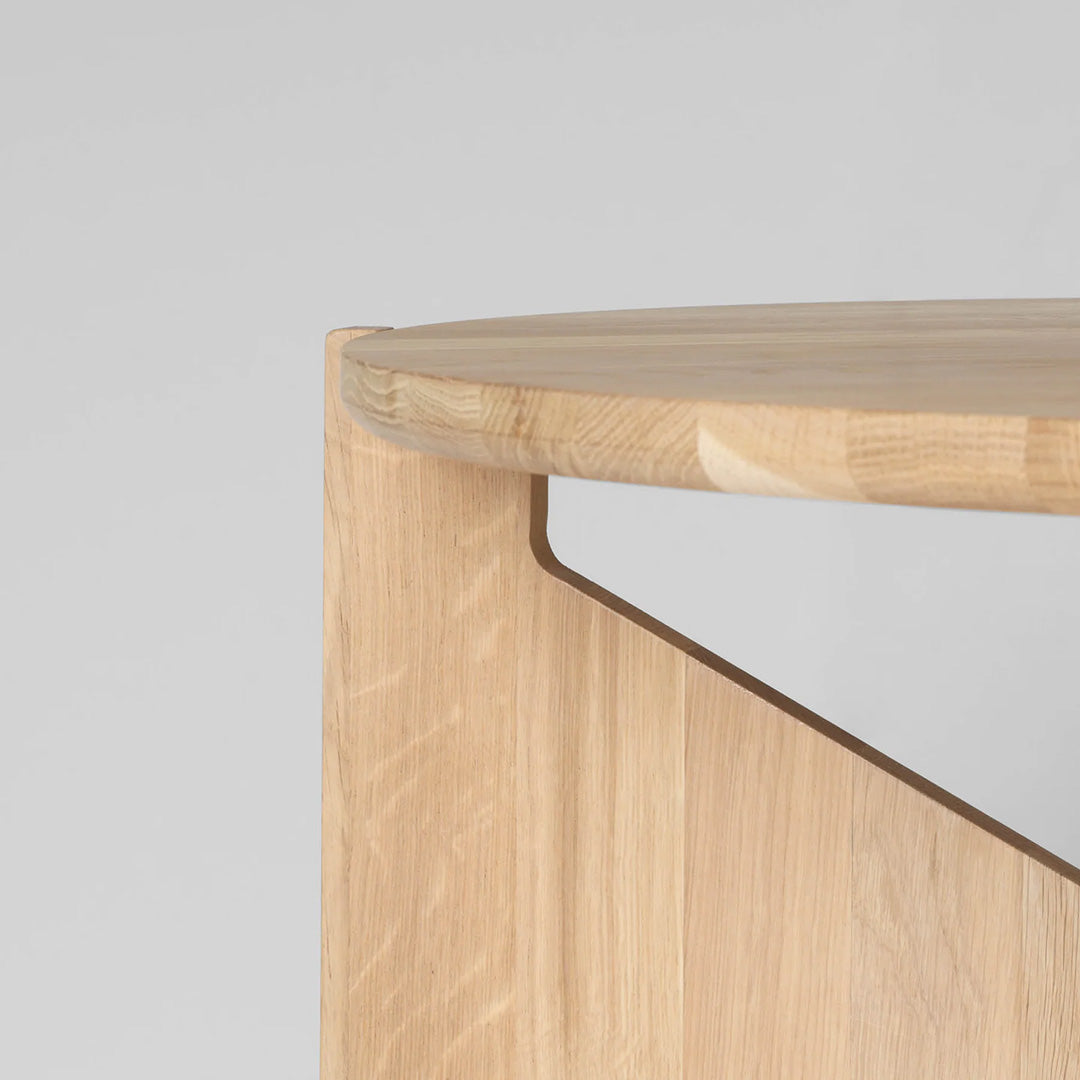 Natural wood finish with smooth grain, featuring a minimalist design and light beige tones.