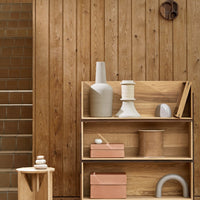 Natural wood tones with textured patterns, featuring soft pastels in containers and sleek, minimalistic shapes.