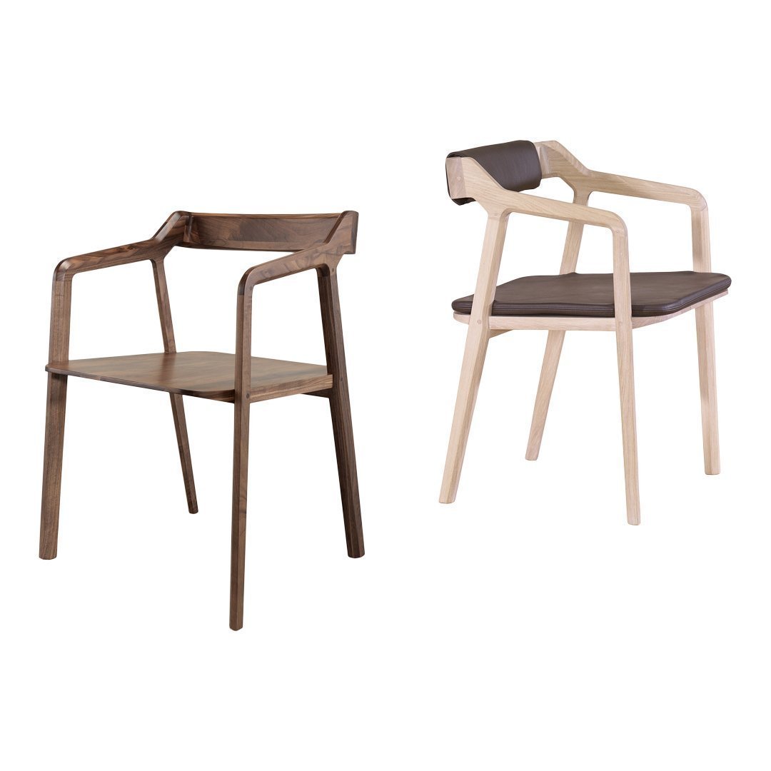 Two modern chairs featuring a mix of dark wood and light wood with minimalistic design and sleek, contrasting seat colors.