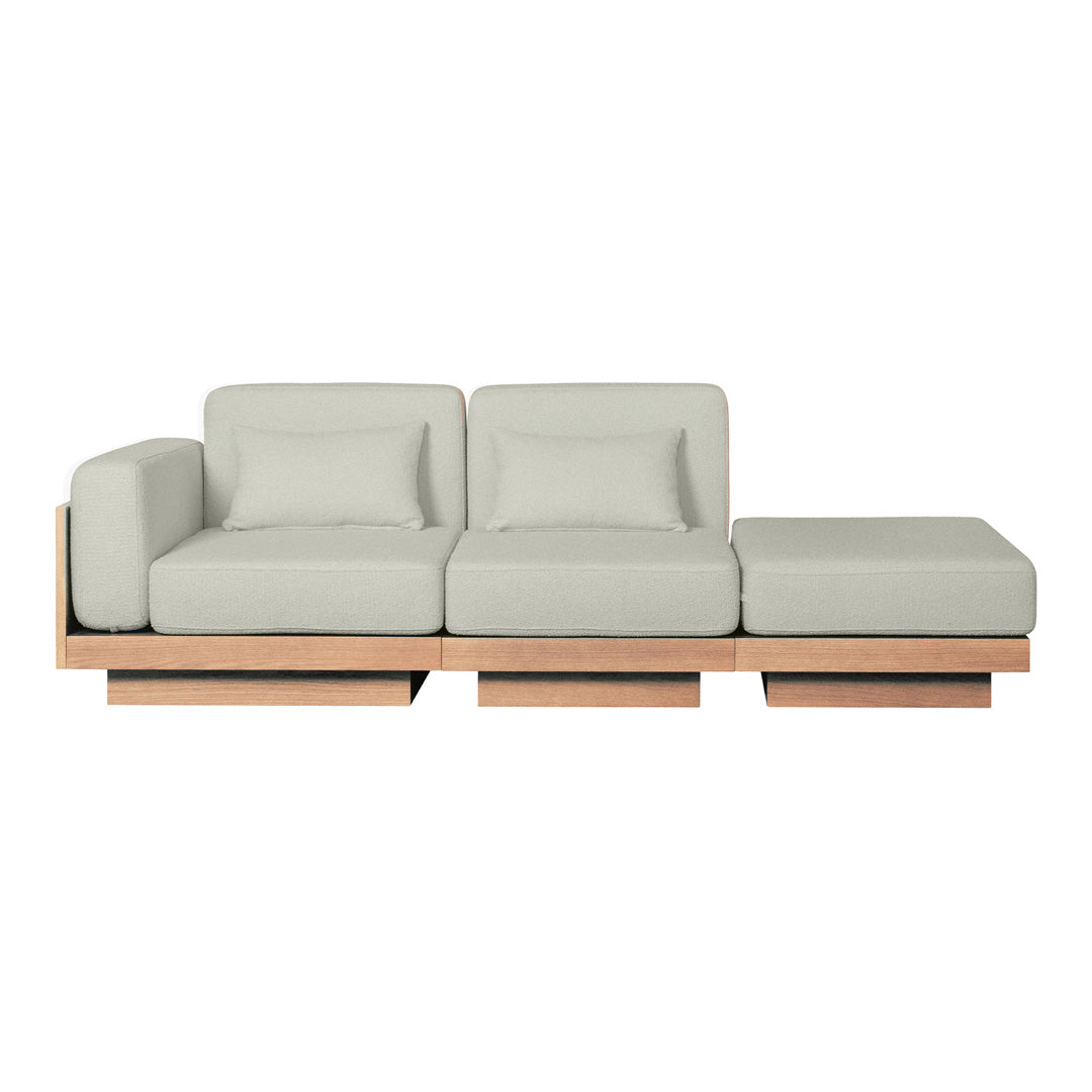 Light gray modular sofa with smooth fabric and natural wood base, featuring minimalist design and contemporary style.