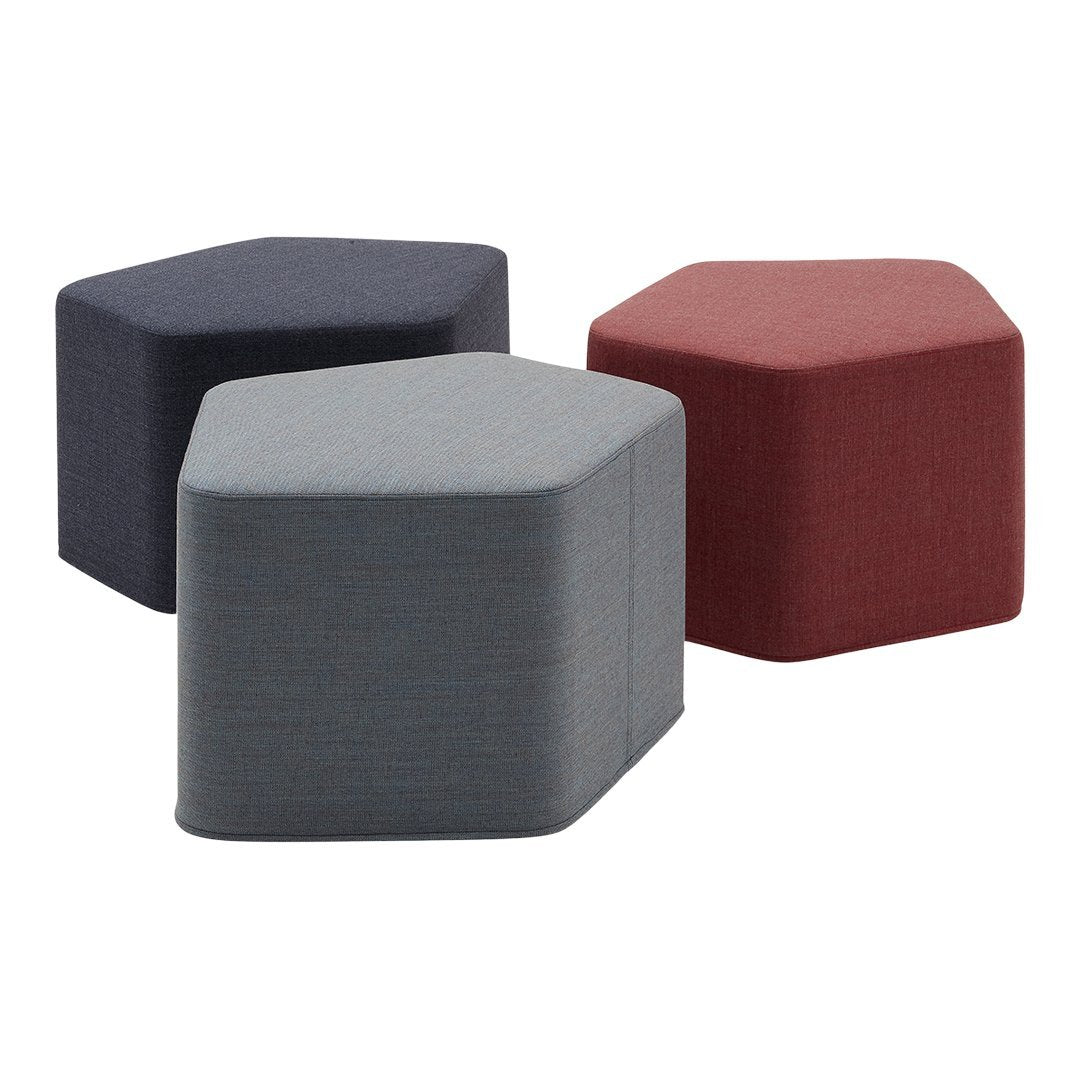 Hexagonal stools in navy blue, gray, and burgundy fabric with a sleek, modern design. Perfect for stylish decor.
