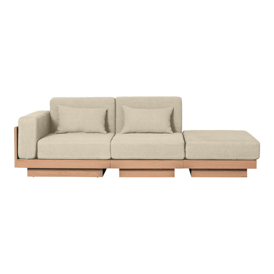 Light beige sofa with plush cushions and a minimalist wooden base, featuring a sleek, modern design.