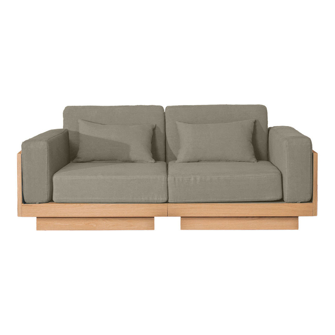 Gray upholstered sofa with clean lines and natural wood frame, featuring a minimalist and modern design.