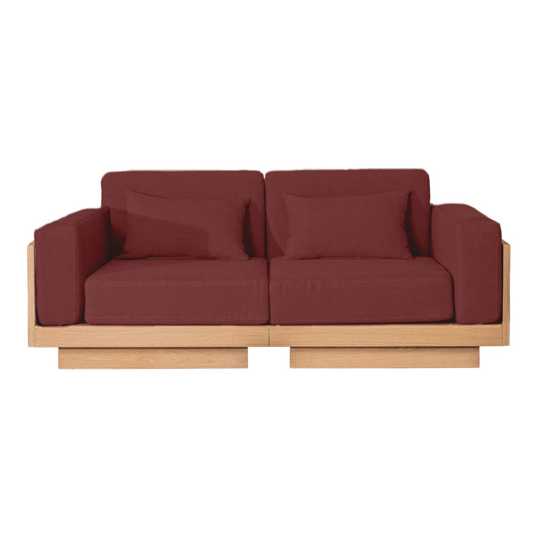 Maroon upholstered sofa with a sleek wooden base, featuring a modern, minimalist design. Ideal for contemporary spaces.