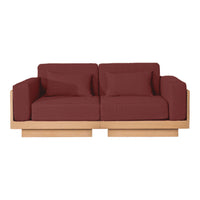 Maroon upholstered sofa with a sleek wooden base, featuring a modern, minimalist design. Ideal for contemporary spaces.