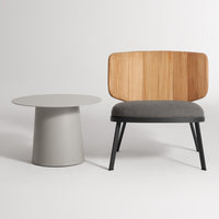 Modern chair with a natural wood back, gray fabric cushion, and a minimalist gray side table.