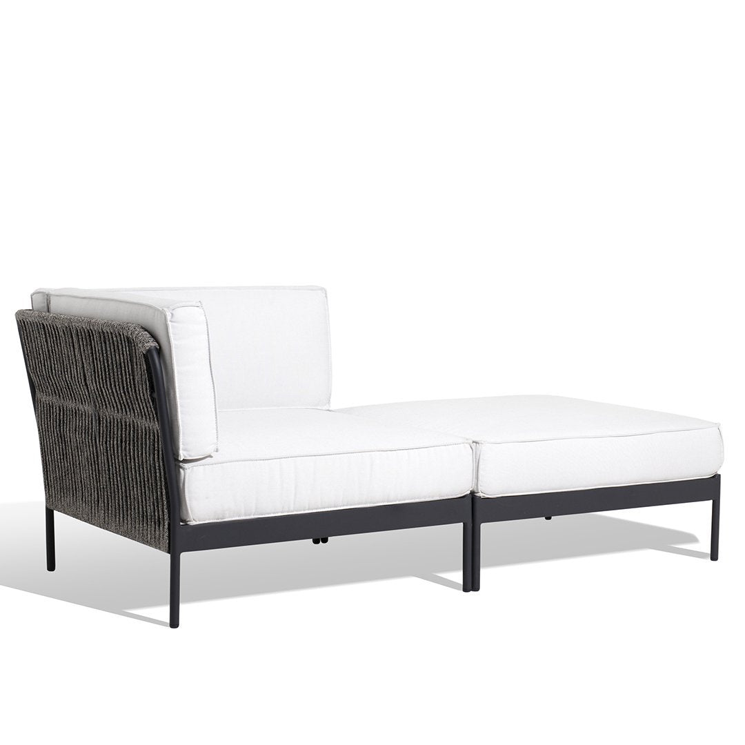 White outdoor sectional sofa with a sleek black metal frame and textured dark gray accents.