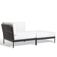 White outdoor sectional sofa with a sleek black metal frame and textured dark gray accents.