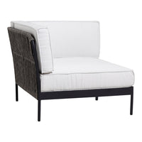 White cushioned chair with a dark woven backrest and sleek black metal frame. Modern, minimalist design.